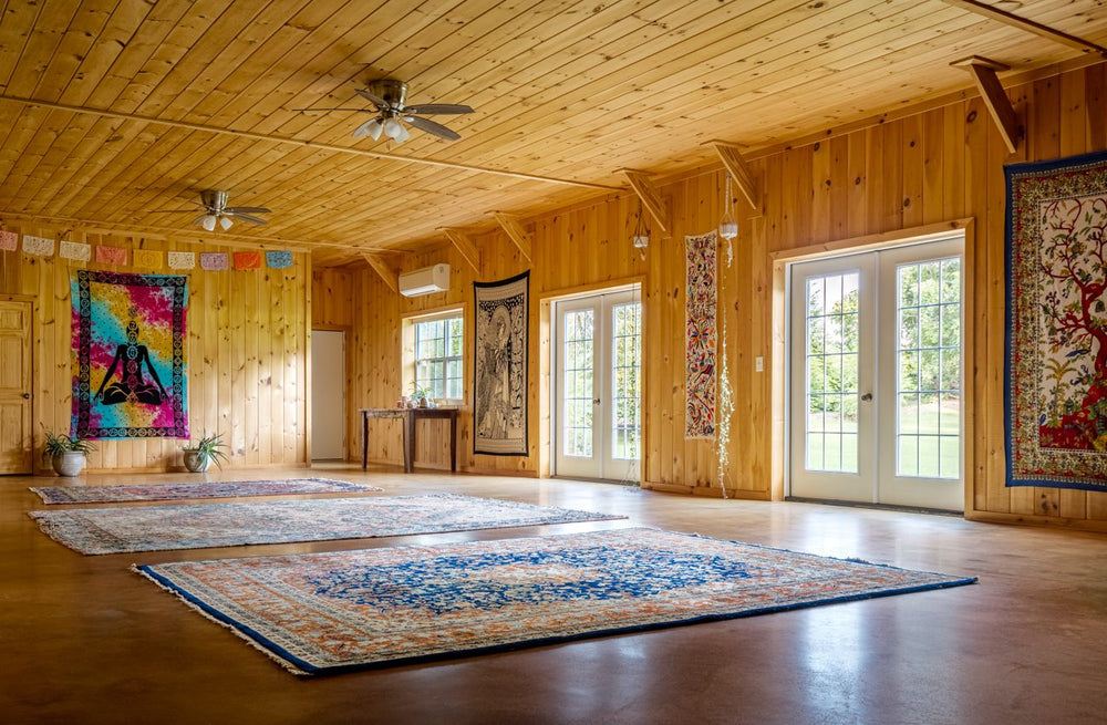 Wooden interior with rugs and wall art